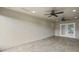 Screened porch with tile flooring and two ceiling fans at 8222 Florida Boys Ranch Rd, Groveland, FL 34736