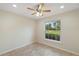 Well lit bedroom with tile floors and large window at 8222 Florida Boys Ranch Rd, Groveland, FL 34736