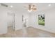 Bright bedroom with tile floors and access to bathroom at 8222 Florida Boys Ranch Rd, Groveland, FL 34736