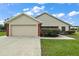 Charming one-story home with attached garage and manicured lawn at 8222 Florida Boys Ranch Rd, Groveland, FL 34736