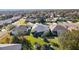 Aerial view showcasing the home's backyard and neighborhood at 25304 Forest Oak Ct, Leesburg, FL 34748