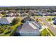 Aerial view of home, neighborhood, and surrounding landscape at 25304 Forest Oak Ct, Leesburg, FL 34748