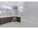 Elegant bathroom with double vanity, soaking tub, and decorative wall art at 25304 Forest Oak Ct, Leesburg, FL 34748