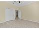 Spacious bedroom with double door closet and tile flooring at 25304 Forest Oak Ct, Leesburg, FL 34748