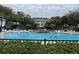 Resort-style community pool with plenty of lounge chairs at 25304 Forest Oak Ct, Leesburg, FL 34748
