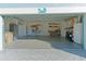 Two-car garage with built-in shelving and storage at 25304 Forest Oak Ct, Leesburg, FL 34748