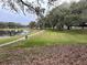 Scenic walking path along the tranquil lake at 25304 Forest Oak Ct, Leesburg, FL 34748