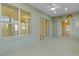Covered lanai with sliding glass doors leading to the backyard at 25304 Forest Oak Ct, Leesburg, FL 34748