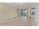 Living room with sliding glass doors leading to the sunroom at 25304 Forest Oak Ct, Leesburg, FL 34748