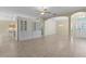 Open living room with views into the kitchen and dining area at 25304 Forest Oak Ct, Leesburg, FL 34748