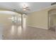 Bright living room featuring tile floors and an open floor plan at 25304 Forest Oak Ct, Leesburg, FL 34748