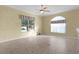 Bright living room featuring neutral walls and tile flooring at 25304 Forest Oak Ct, Leesburg, FL 34748