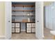 Well-organized pantry with ample shelving for food storage at 25304 Forest Oak Ct, Leesburg, FL 34748