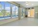 Spacious sunroom with multiple windows and sliding glass doors at 25304 Forest Oak Ct, Leesburg, FL 34748