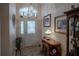 Bright entryway with decorative console table and framed art at 6062 Armada St, Tavares, FL 32778