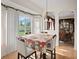 Bright dining room with a large table and window offering a view at 18744 Sabal St, Orlando, FL 32833