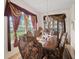 Formal dining room with ornate furniture and a chandelier at 18744 Sabal St, Orlando, FL 32833