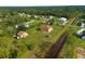 Wide shot showing home's large lot, canal views and neighborhood context at 18744 Sabal St, Orlando, FL 32833