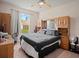 Main bedroom with a king-size bed and built-in shelving at 18744 Sabal St, Orlando, FL 32833