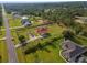 Home is situated on a large lot with a view of a nearby road at 18744 Sabal St, Orlando, FL 32833