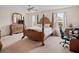 Main bedroom with a large wooden bed and ensuite bathroom at 18744 Sabal St, Orlando, FL 32833