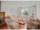 Cozy living room with floral sofas and built-in shelving at 18744 Sabal St, Orlando, FL 32833