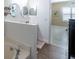 Clean bathroom with a bathtub, double sinks, and a separate shower at 615 Del Pilar Dr, Groveland, FL 34736