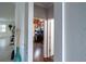 Hallway view of home office with brick accent wall at 615 Del Pilar Dr, Groveland, FL 34736