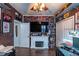 Game room with a fireplace, large screen TV, and abundant collectibles at 615 Del Pilar Dr, Groveland, FL 34736