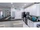 Modern kitchen with white cabinets, granite counters, and island at 615 Del Pilar Dr, Groveland, FL 34736