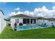 Inviting backyard oasis with a refreshing pool and patio area at 615 Del Pilar Dr, Groveland, FL 34736