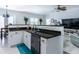 Open concept kitchen with granite island and breakfast bar at 615 Del Pilar Dr, Groveland, FL 34736