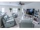 Living room with comfortable seating and large TV at 615 Del Pilar Dr, Groveland, FL 34736