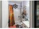 Small bathroom with a shower/tub combo and nautical theme at 615 Del Pilar Dr, Groveland, FL 34736