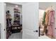 Large walk-in closet with ample storage and en-suite bathroom at 615 Del Pilar Dr, Groveland, FL 34736
