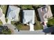 An aerial view of a home with a driveway in a quiet neighborhood at 17755 Se 85Th Ellerbe Ave, The Villages, FL 32162