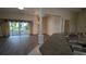 Dining area with wood-look flooring, chandelier, and sliding glass doors to the backyard at 17755 Se 85Th Ellerbe Ave, The Villages, FL 32162