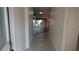 Welcoming foyer with tile flooring and a view into the living area at 17755 Se 85Th Ellerbe Ave, The Villages, FL 32162