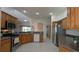 Spacious kitchen with oak cabinets, stainless steel appliances, and ample counter space at 17755 Se 85Th Ellerbe Ave, The Villages, FL 32162