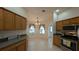 Eat-in kitchen with oak cabinets, stainless steel appliances, and a breakfast nook at 17755 Se 85Th Ellerbe Ave, The Villages, FL 32162