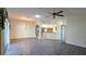 Bright living room with wood-look flooring, open to the kitchen and dining areas at 17755 Se 85Th Ellerbe Ave, The Villages, FL 32162
