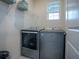 Laundry room with Maytag washer and dryer at 5035 Stokes Way, Wildwood, FL 34785