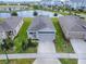 Aerial view of home, lawn, and community at 5035 Stokes Way, Wildwood, FL 34785