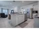 Modern kitchen with stainless steel appliances and granite countertops at 5035 Stokes Way, Wildwood, FL 34785
