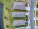 Aerial view of a single Gathering home next to a lake at 5035 Stokes Way, Wildwood, FL 34785