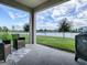 Covered patio overlooking a lake at 5035 Stokes Way, Wildwood, FL 34785
