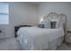 Bright bedroom with a comfortable bed and neutral decor at 5035 Stokes Way, Wildwood, FL 34785