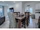 Casual dining area with wooden table and chairs at 5035 Stokes Way, Wildwood, FL 34785