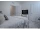 Spacious bedroom with a plush bed and plenty of closet space at 5035 Stokes Way, Wildwood, FL 34785