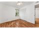 Bedroom with wood-look floors, window, and large closet at 1010 Loch Vail # 1112, Apopka, FL 32712